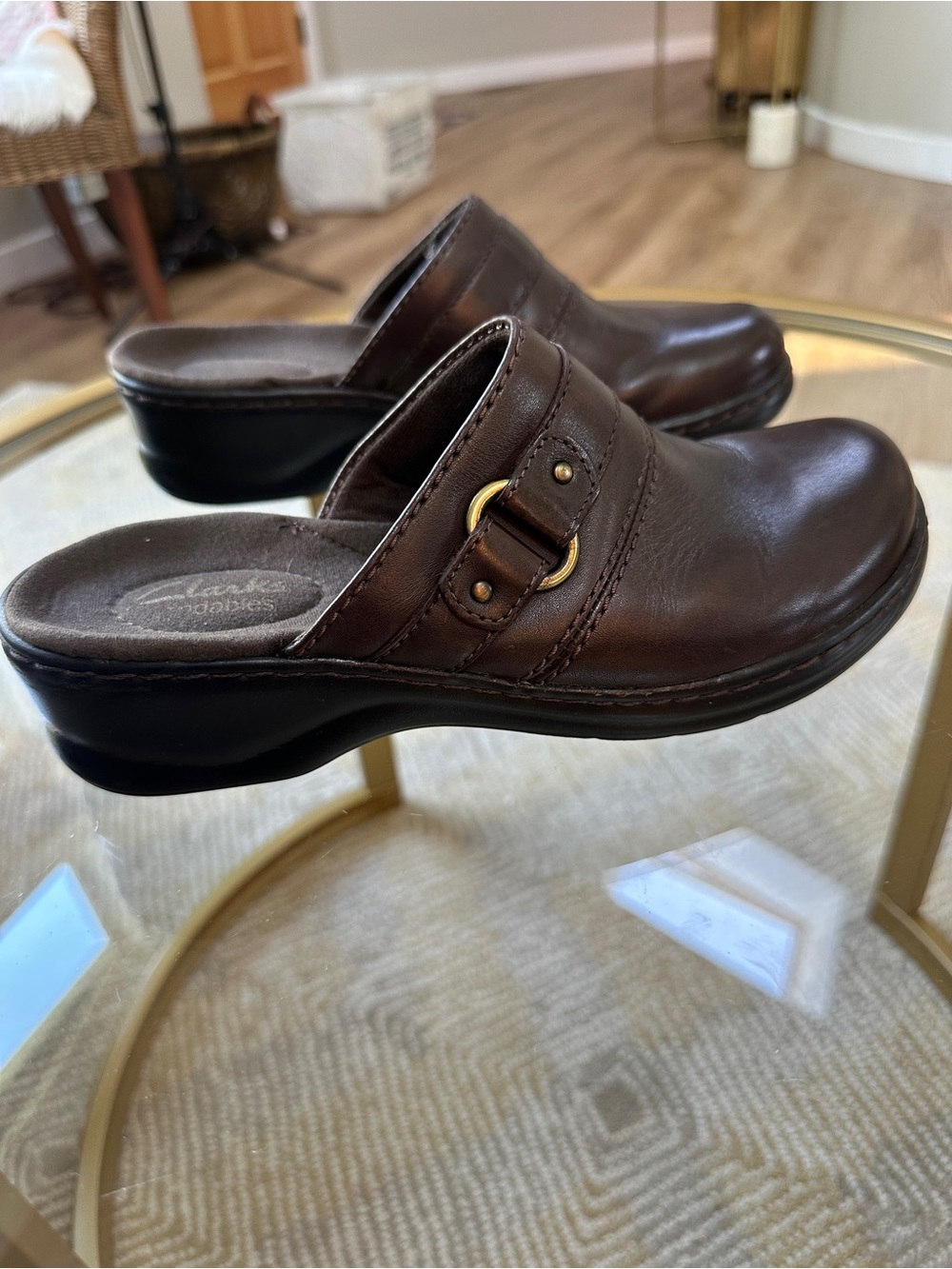 Clarks Delana Amber brown leather mule clogs featuring a decorative side strap